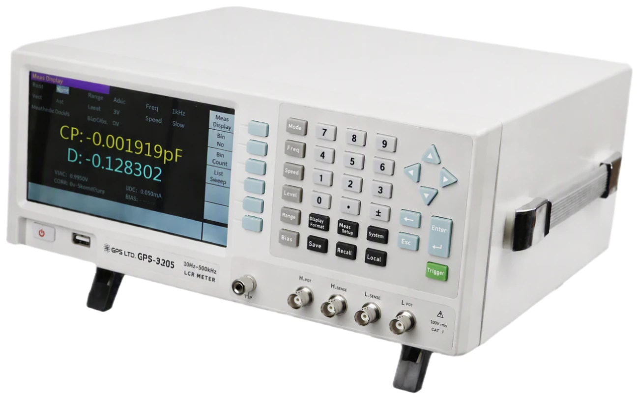 GPS LTD GPS-3205 benchtop LCR meter seen from the front and side, showing the colour display with the measurement settings above a capacitance and dissipation reading, the numeric keypad, and the four BNC test terminals marked H pot, H sense, L sense and L pot beside the guard terminal